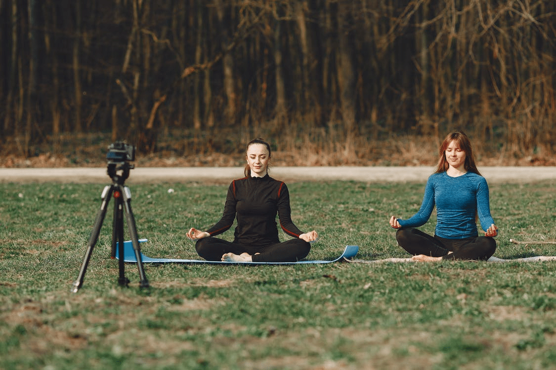 Two people practicing mindful meditation