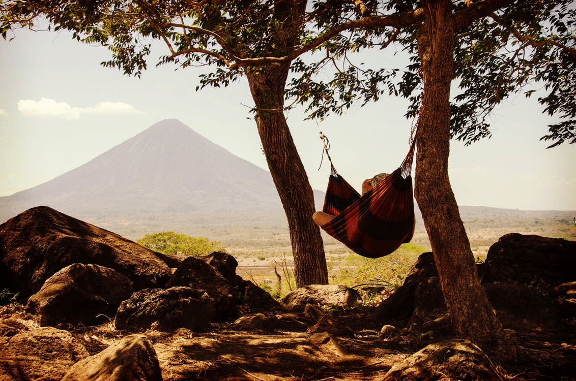 A person relaxing in a hammock after a long workday