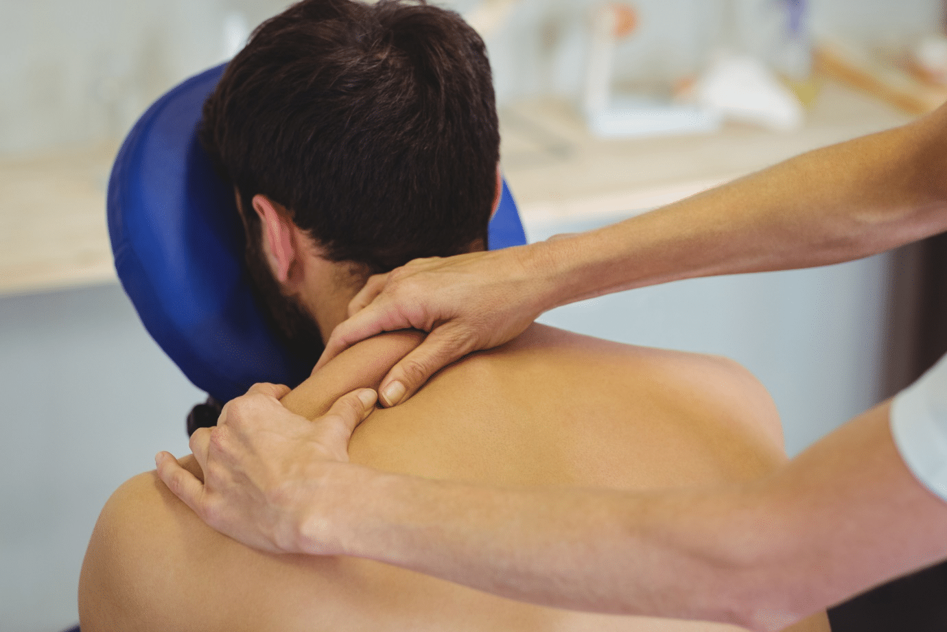 A person receiving massage PT as a treatment for musculoskeletal pain.