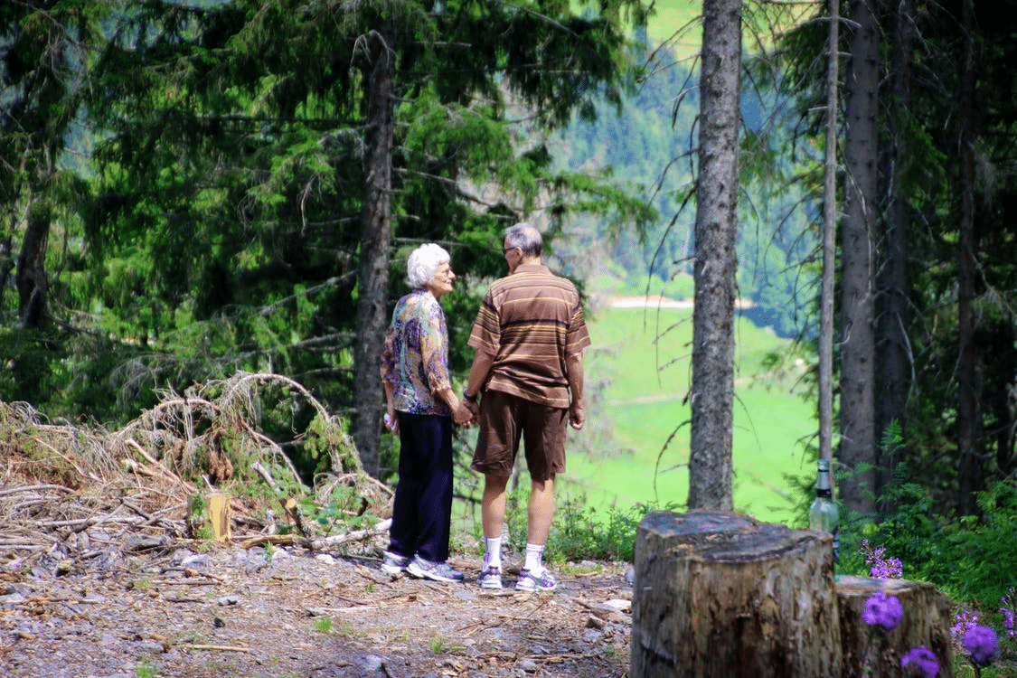 An old couple walking together.