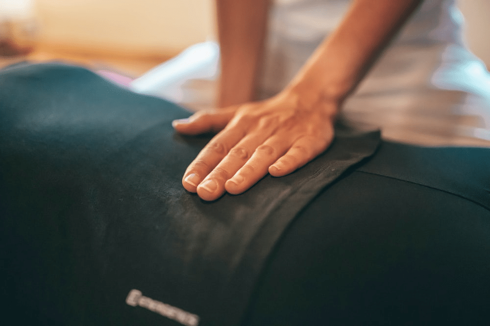 Physical therapist giving back massage